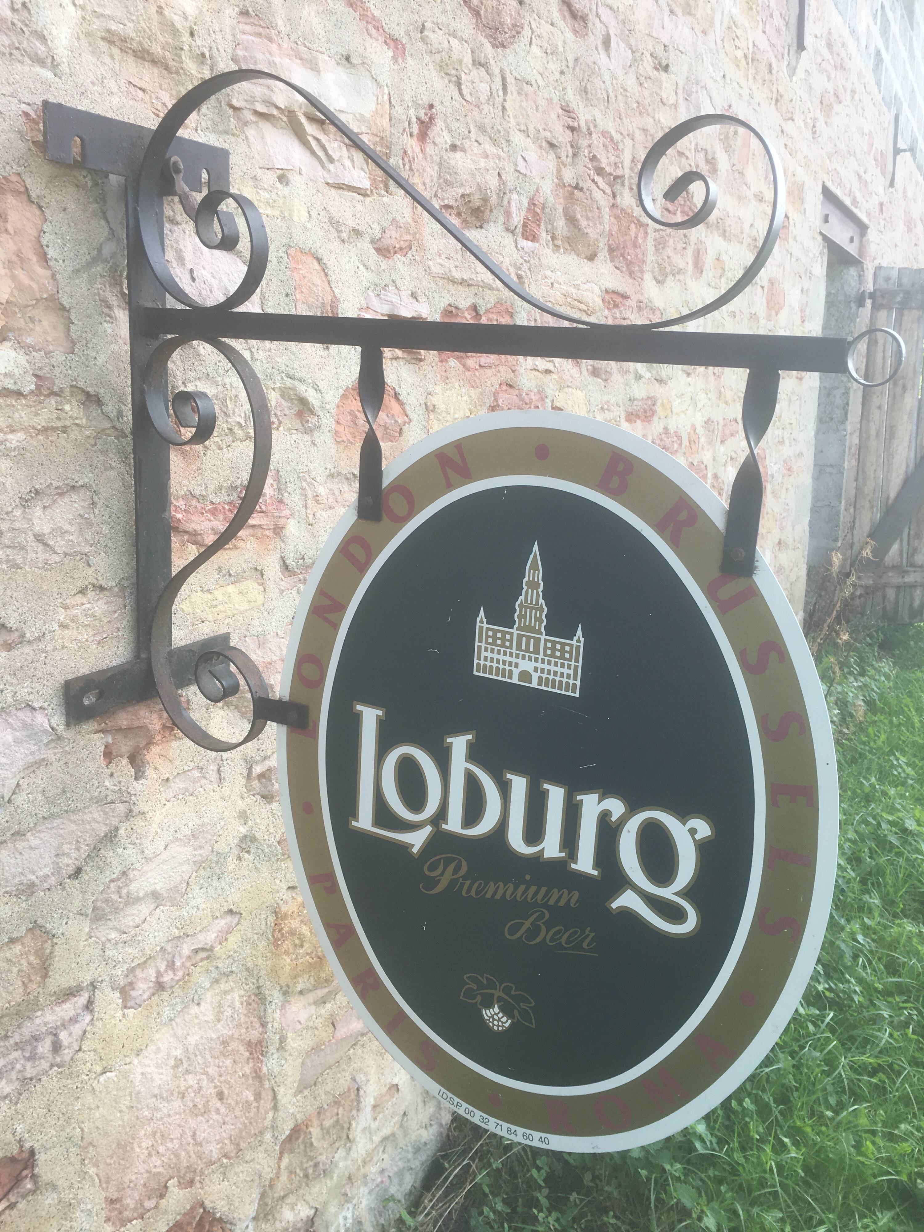 Double-sided "Loburg Beer" metal sign on wrought iron bracket
