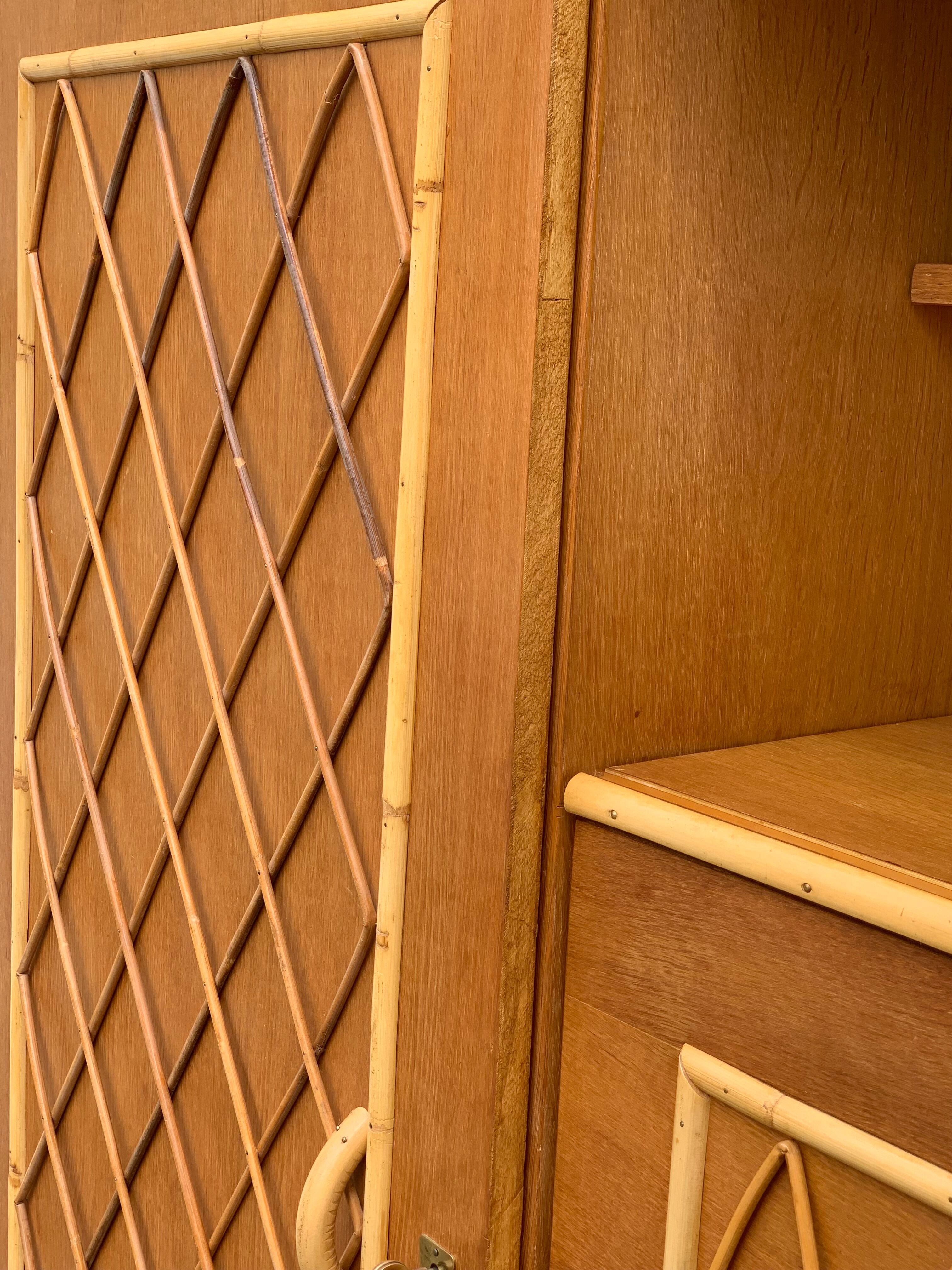 Rattan wardrobe with tapered legs from the 1960s.