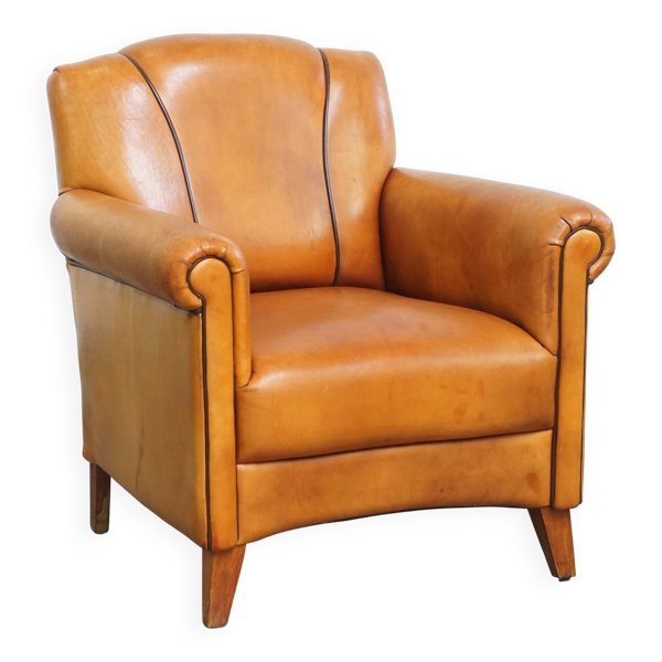 Fauteuil en cuir de mouton et passepoil marron foncé