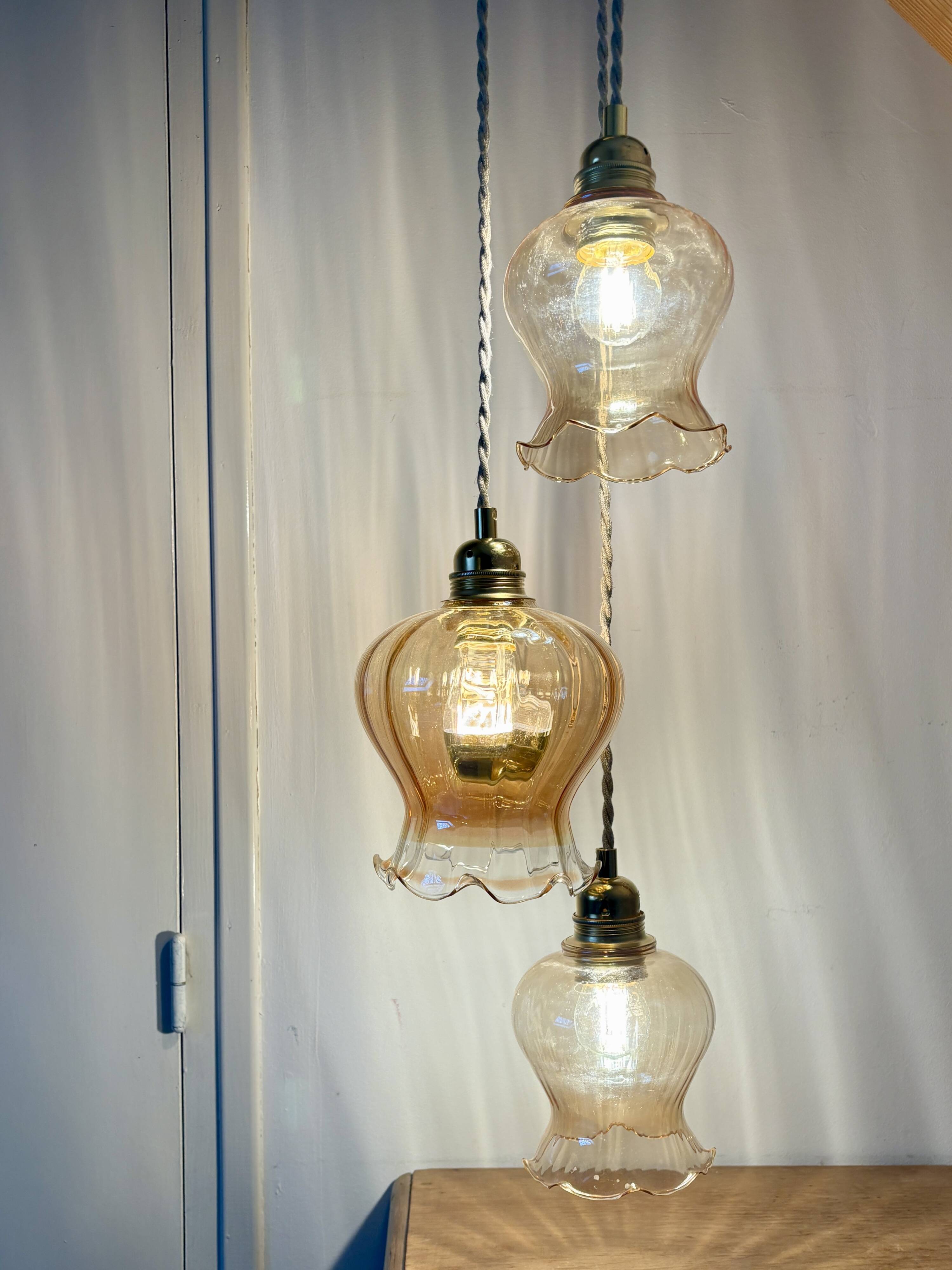 Triple vintage tulip pendant light in amber glass