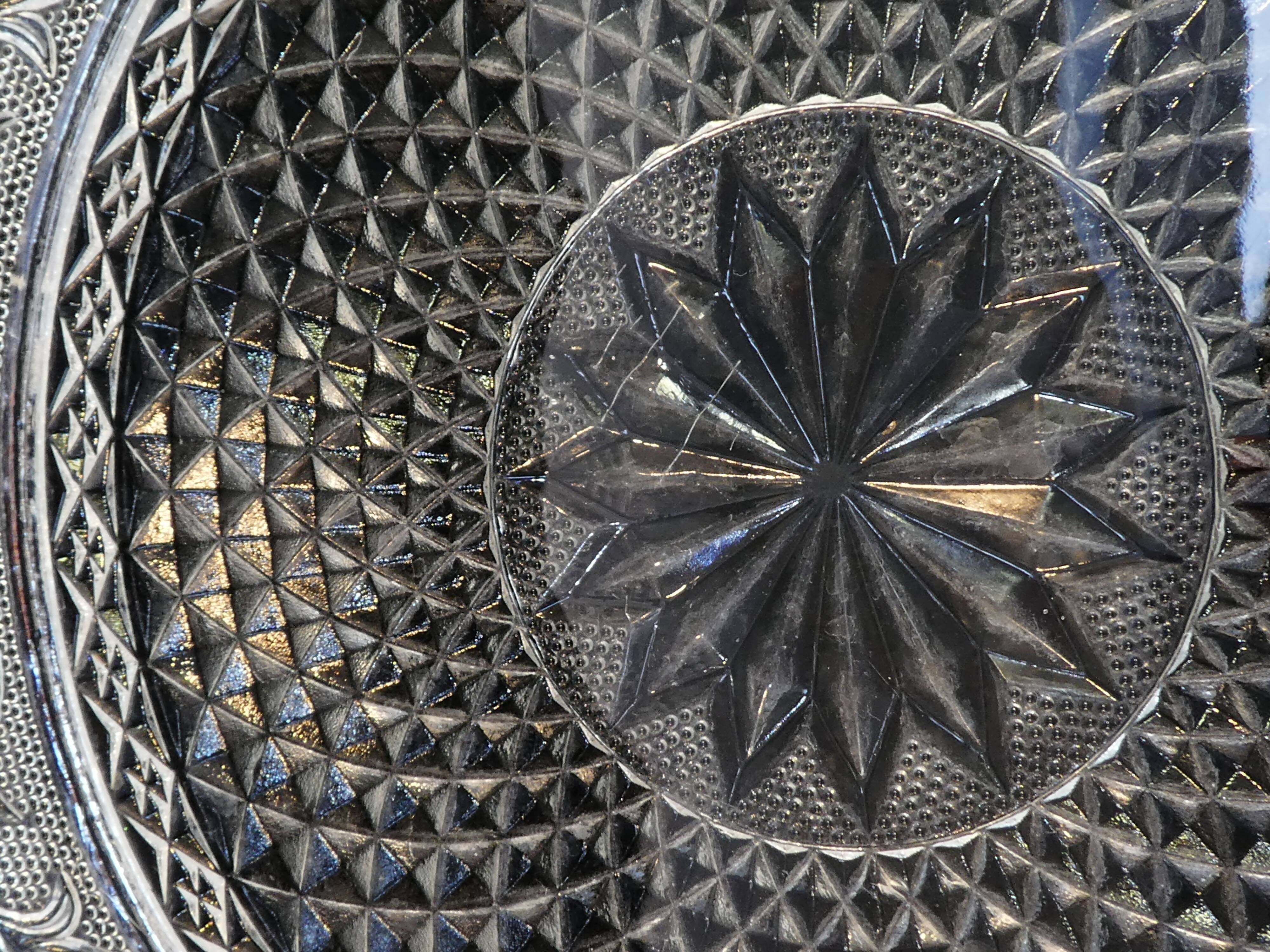 Old plate with pressed glass arabesque pie