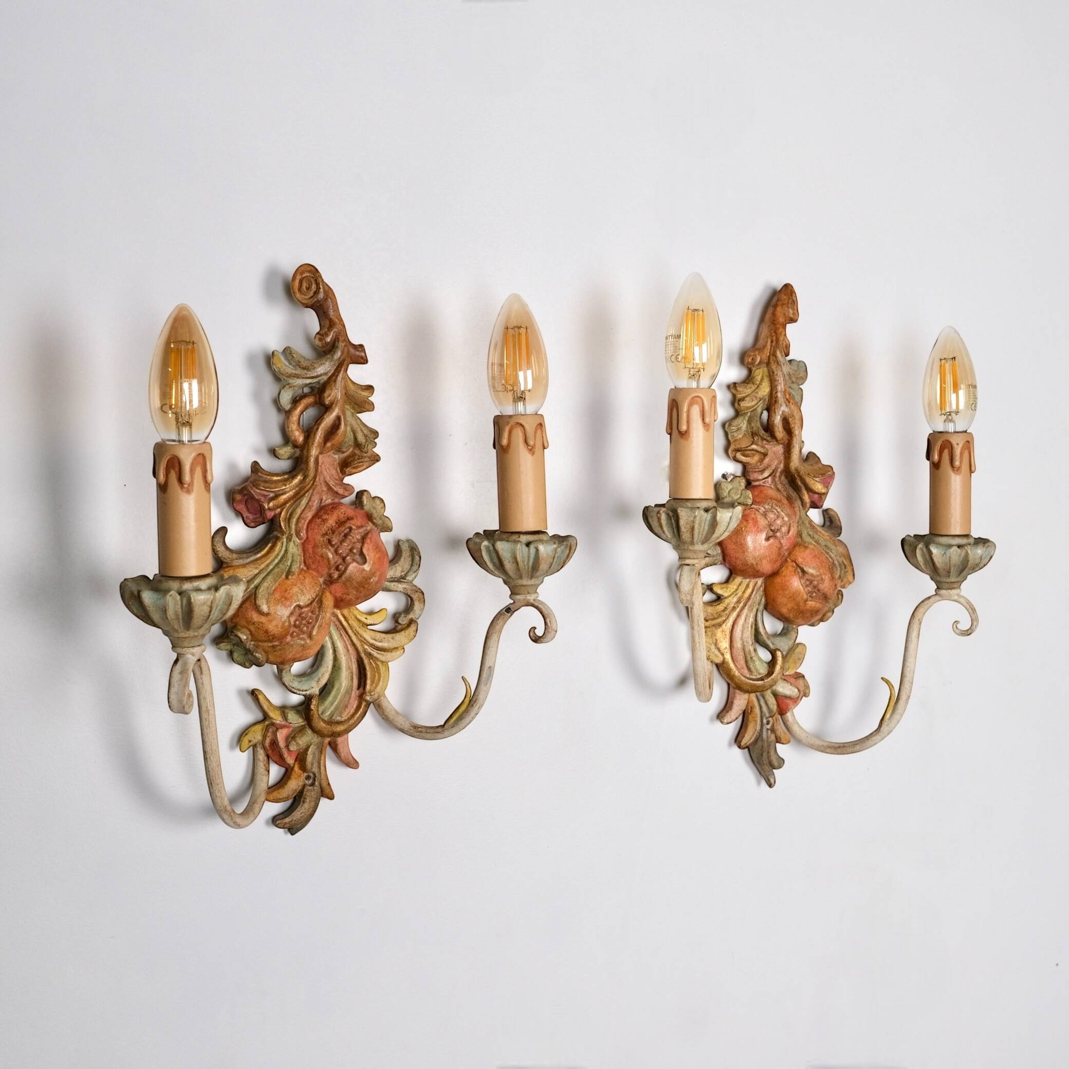 Pair of carved wood and metal sconces, Chelini FIrenze, Italy