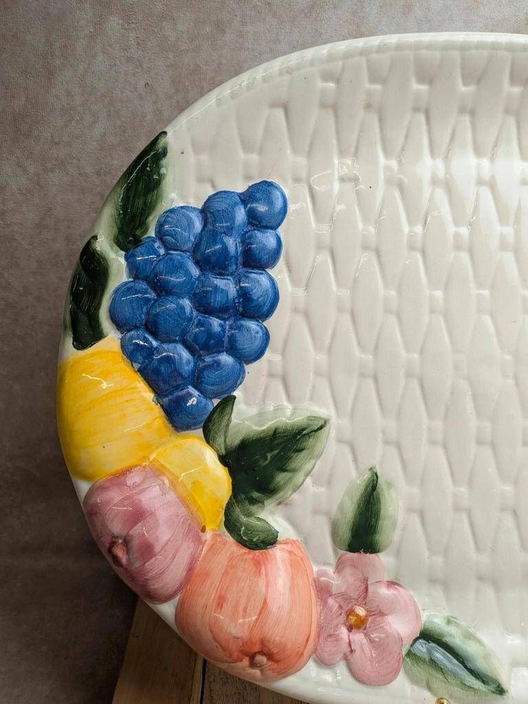 Vintage oval serving dish in majolica – Relief fruit decoration and woven basket design.