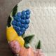 Vintage oval serving dish in majolica – Relief fruit decoration and woven basket design.