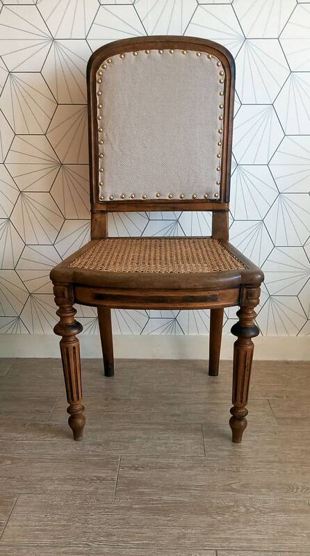 Solid oak art deco chair with cane and fabric.