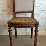 Solid oak art deco chair with cane and fabric.
