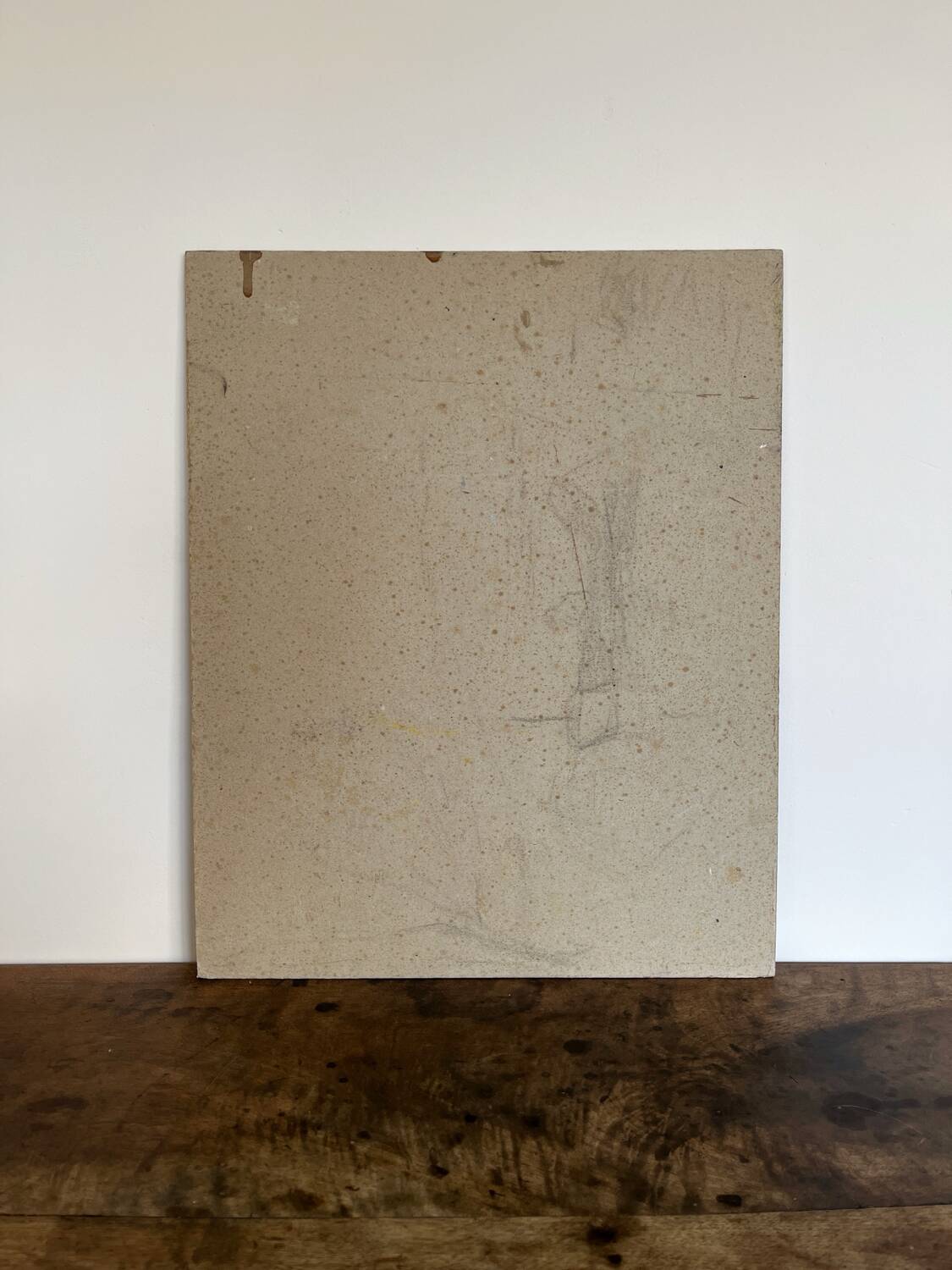 Old oil painting on cardboard portrait of a man in a blue suit