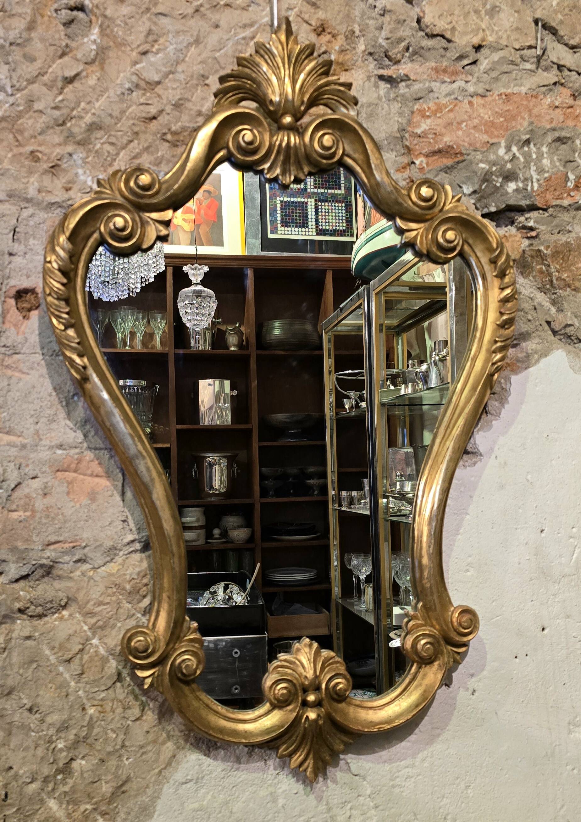 Carved and gilded wooden mirror, Louis XV style - 94 cm