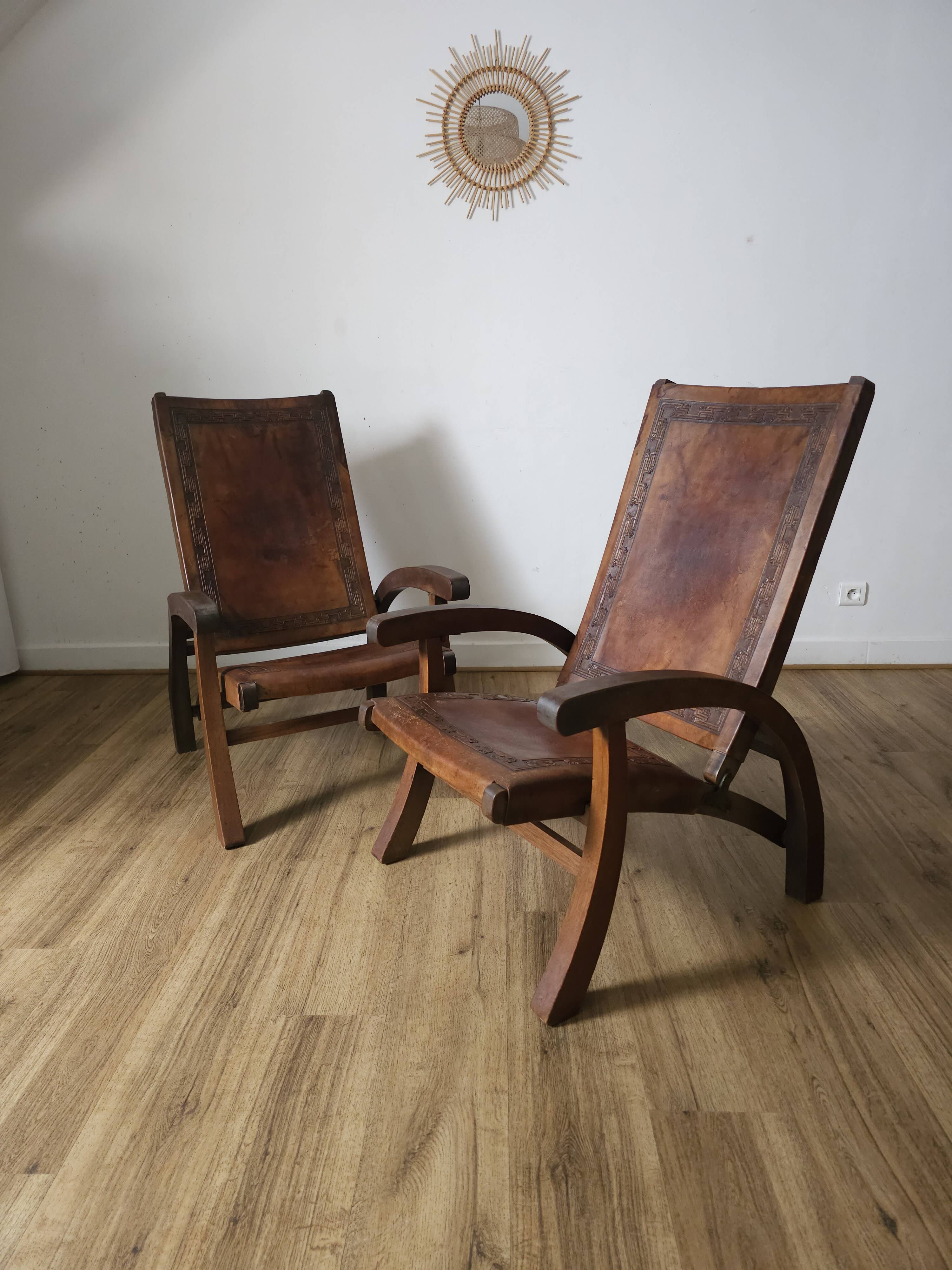 Leather and teak armchairs, by Angel Pazmino, circa 1960.