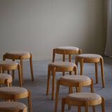 Modern Swedish, set of 14 stackable stools in birch and hessian fabric, 1980s.
