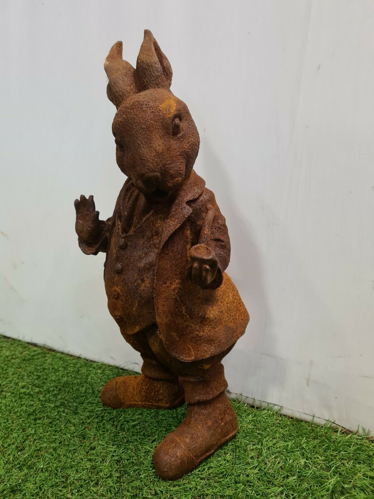 Rabbit with a cast iron pipe garden statue