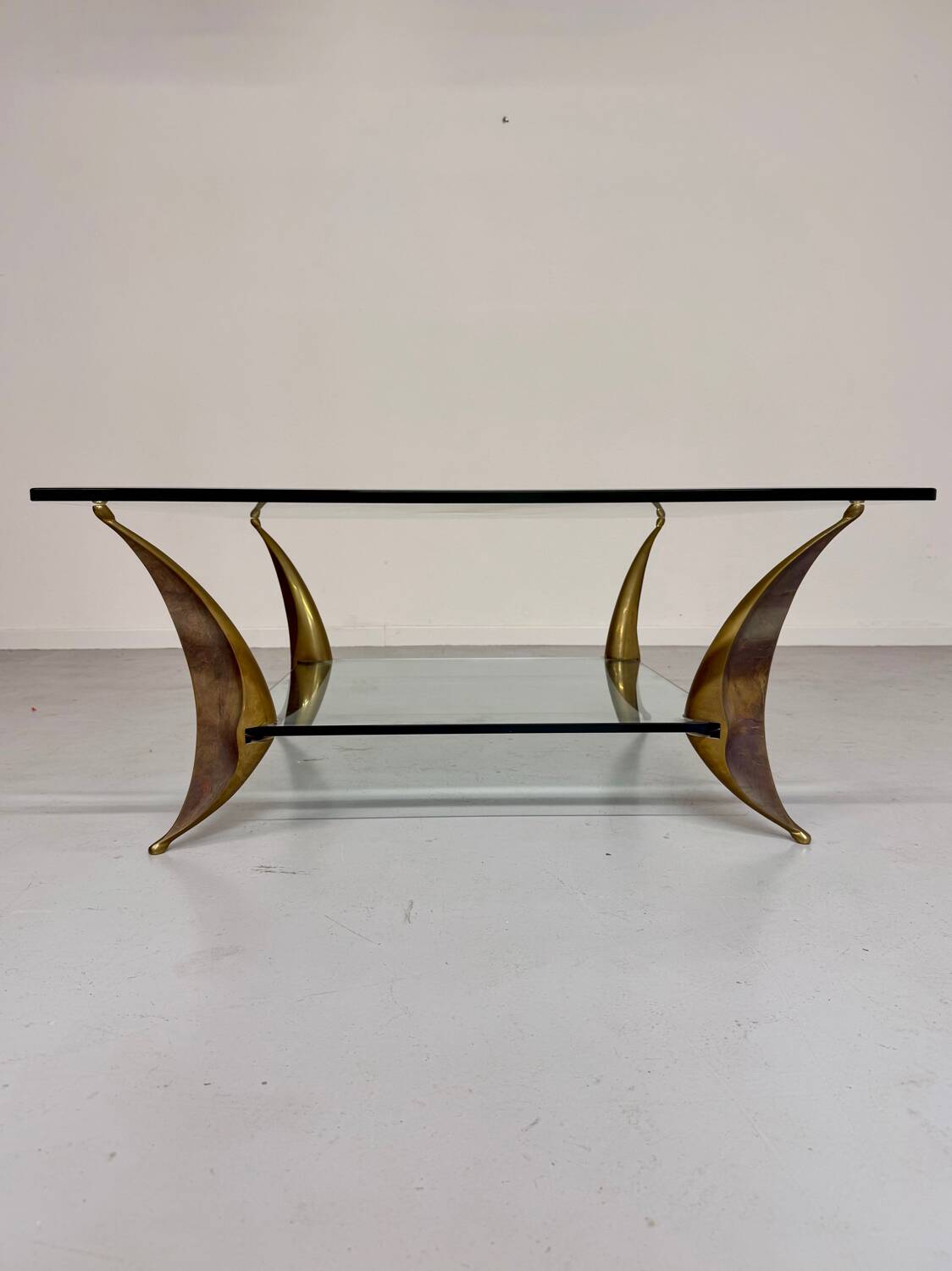 Glass coffee table with solid brass legs, Italian design from the 60s