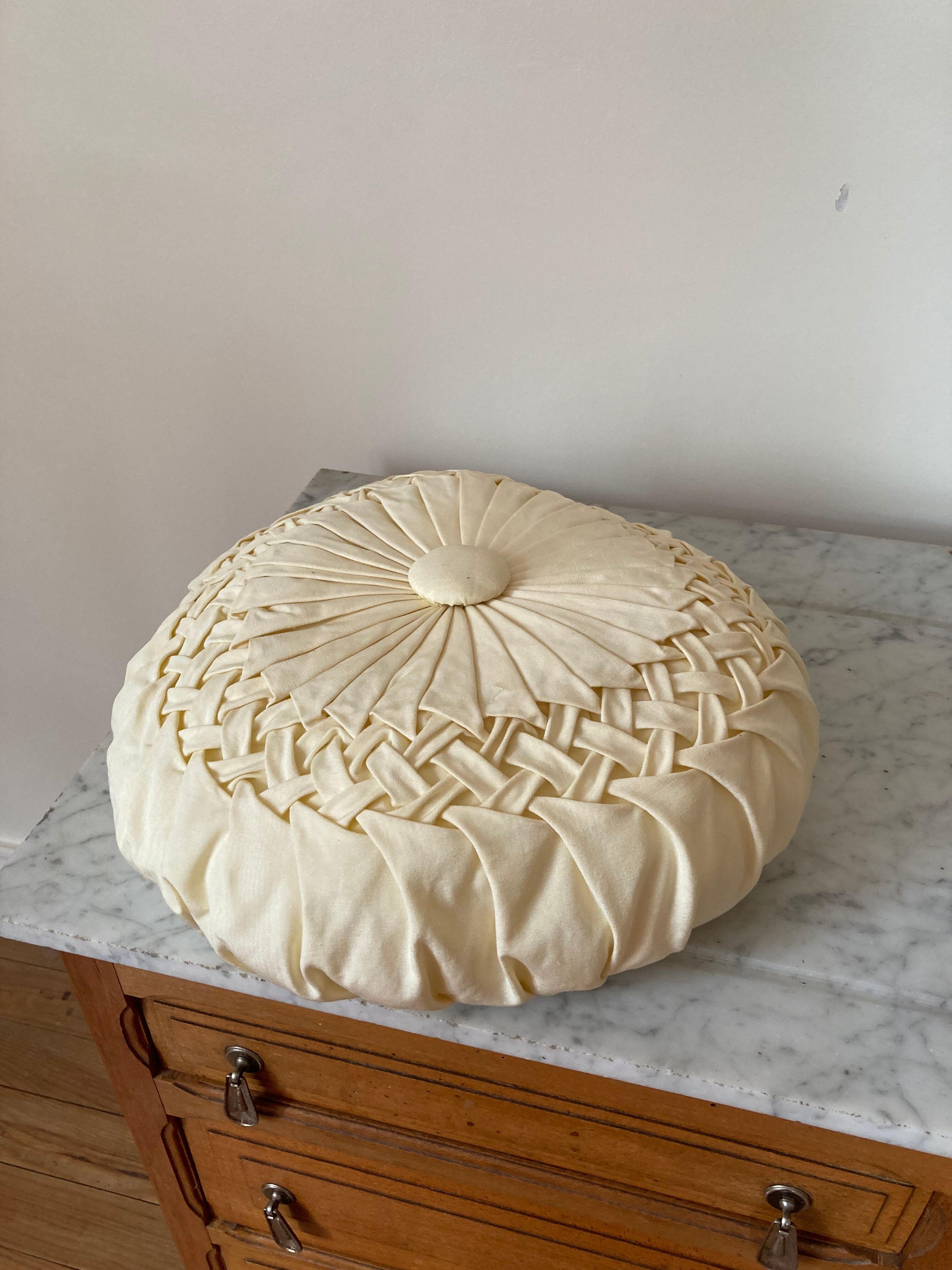 Cushion in beige fabric