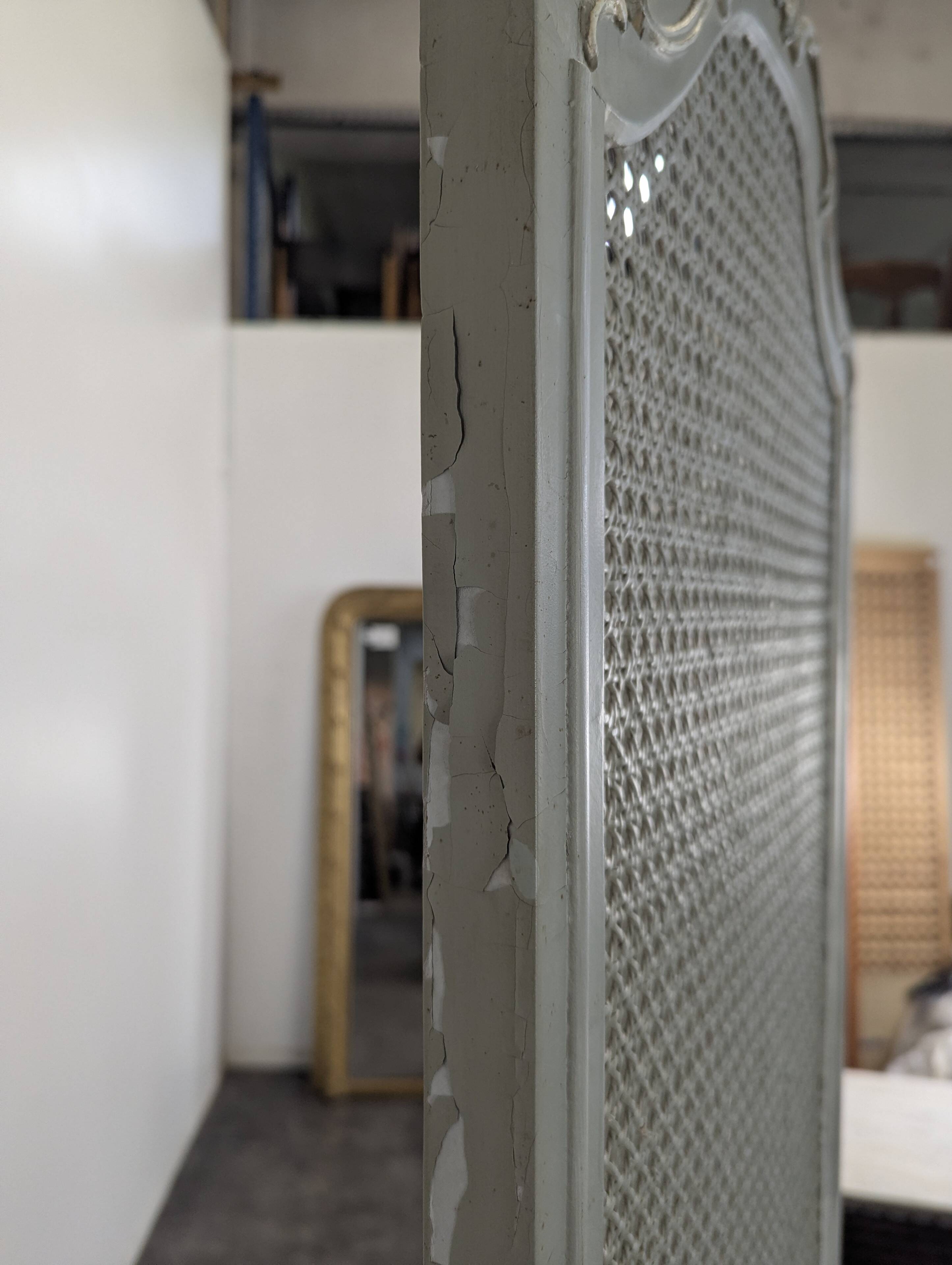 Louis XVI style caned screen with a re-champis finish.