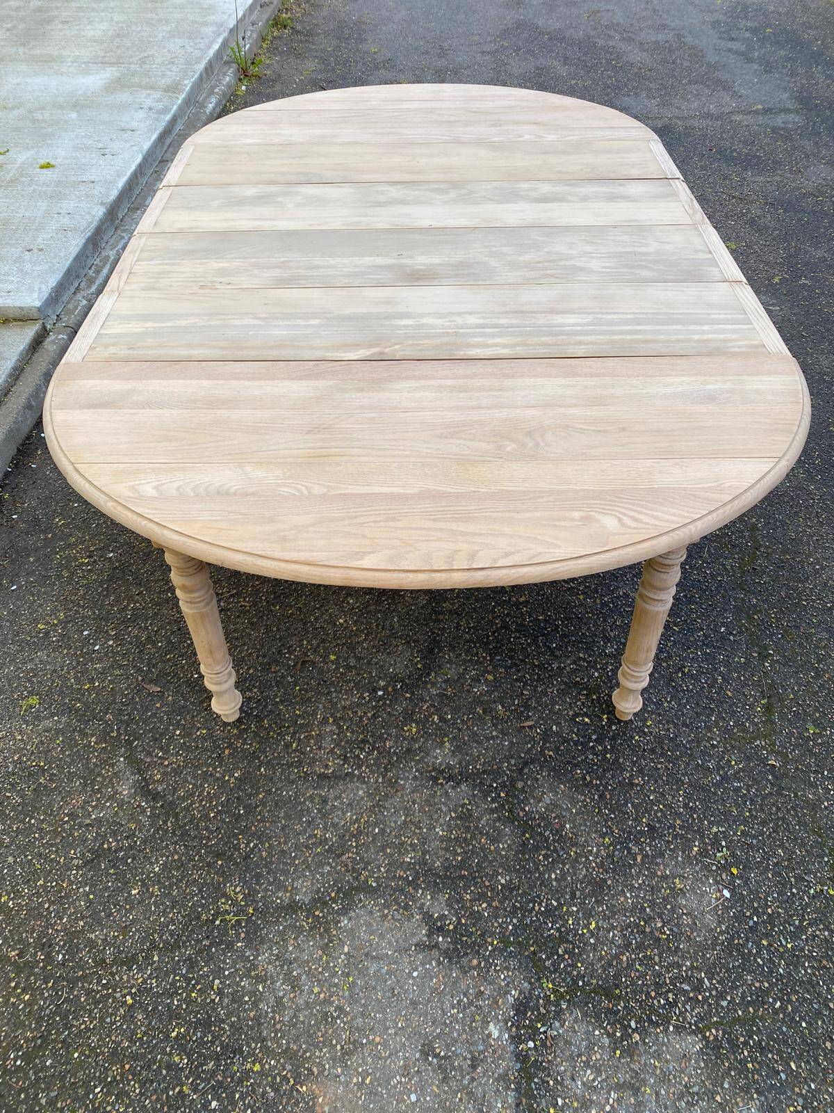 Renovated Louis Philippe round extendable dining table with 4 leaves.