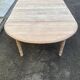 Renovated Louis Philippe round extendable dining table with 4 leaves.