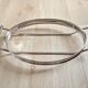 Oval Pyrex gratin dish, silver-plated metal stand.
