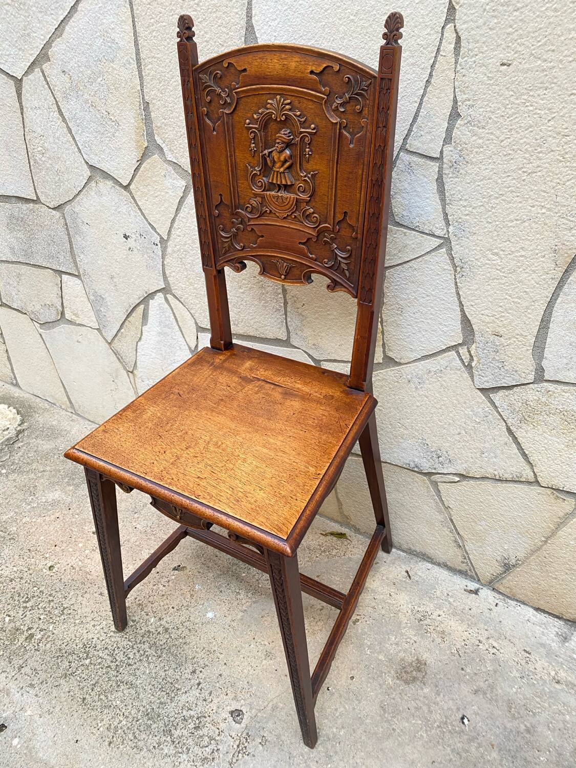 Carved walnut lounge chair