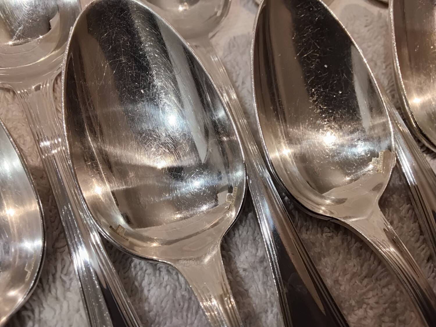 12 Christofle silver plated dessert spoons, 17cm