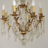 French Louis XV chandelier with 8 lights in gilded bronze, glass and crystal.