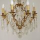 French Louis XV chandelier with 8 lights in gilded bronze, glass and crystal.