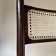 Set de quatre chaises pliantes en bois et cannage