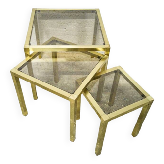 Trio of nesting tables in brass and smoked glass