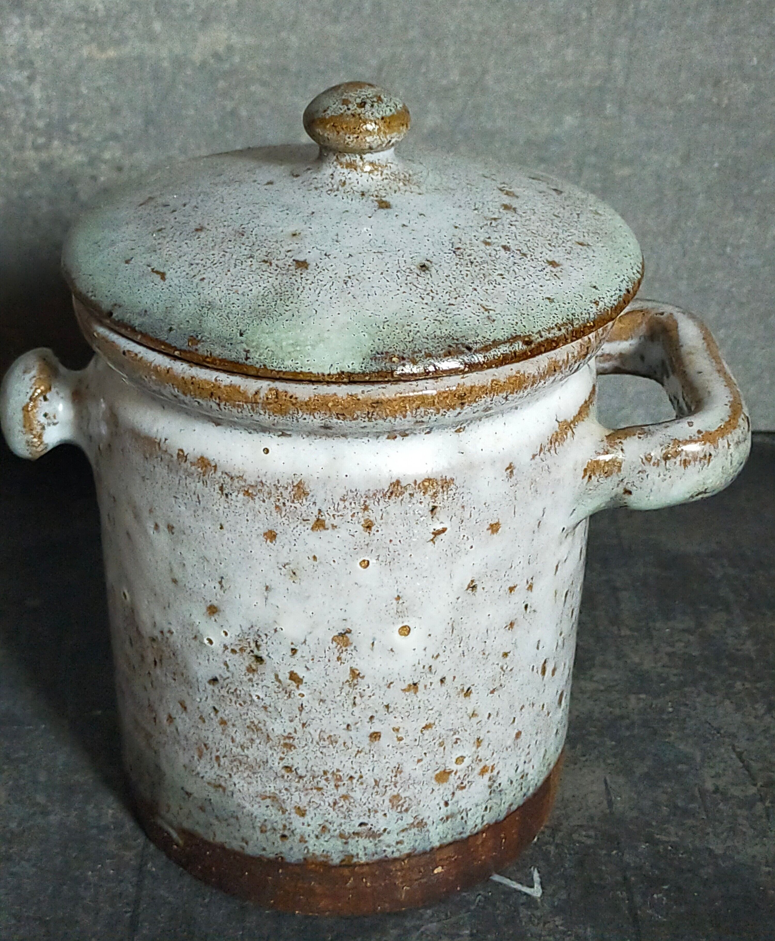Duo of potter's pots covered in vintage glazed stoneware