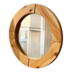 Round mirror in raw wood