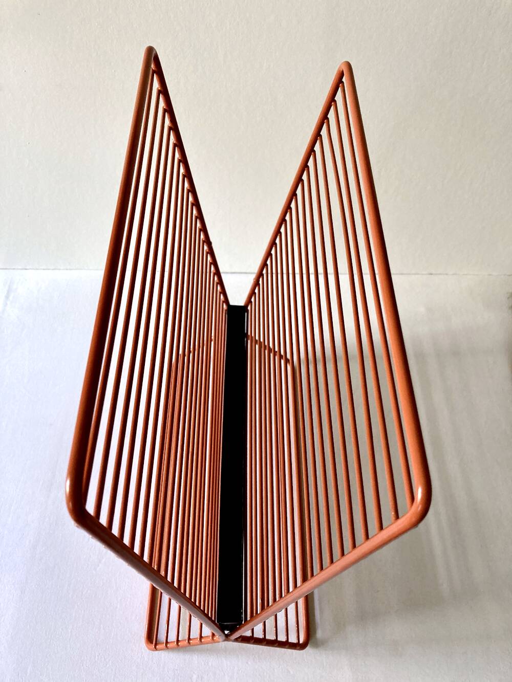 Wire metal magazine rack with triangular compartment, 1950s.