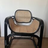 Black armchair with cane and natural rattan