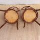 pair of bistro chairs, curved wood and pattern on the seat