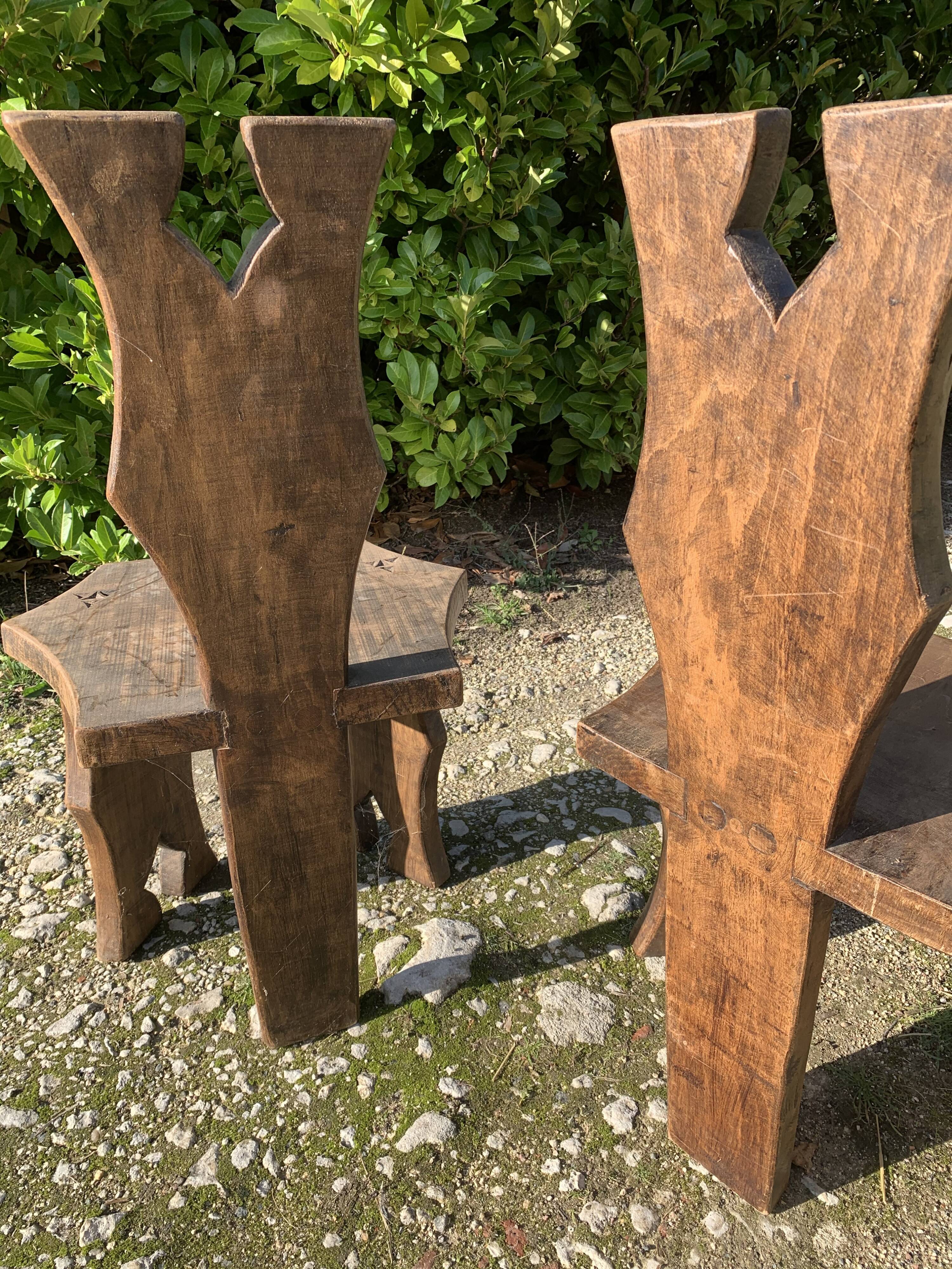 2 solid wood Johnny Ludecher folk art chairs