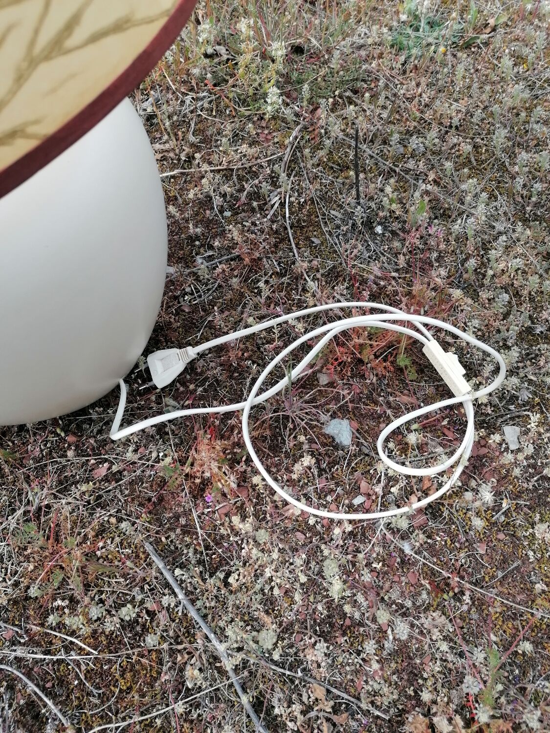 Vintage ceramic table lamp and golden lampshade.