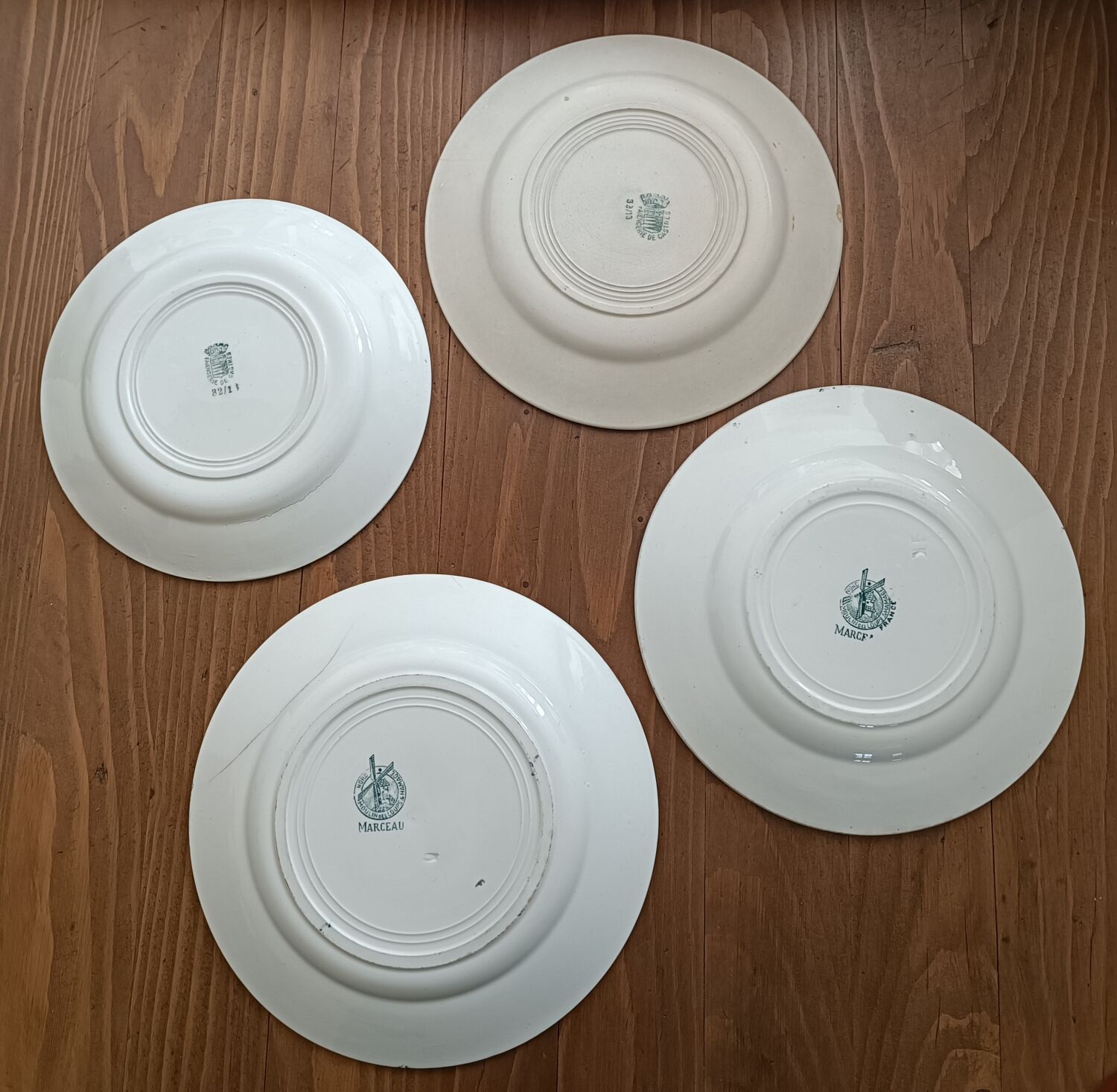 Set of 4 mismatched iron earth plates