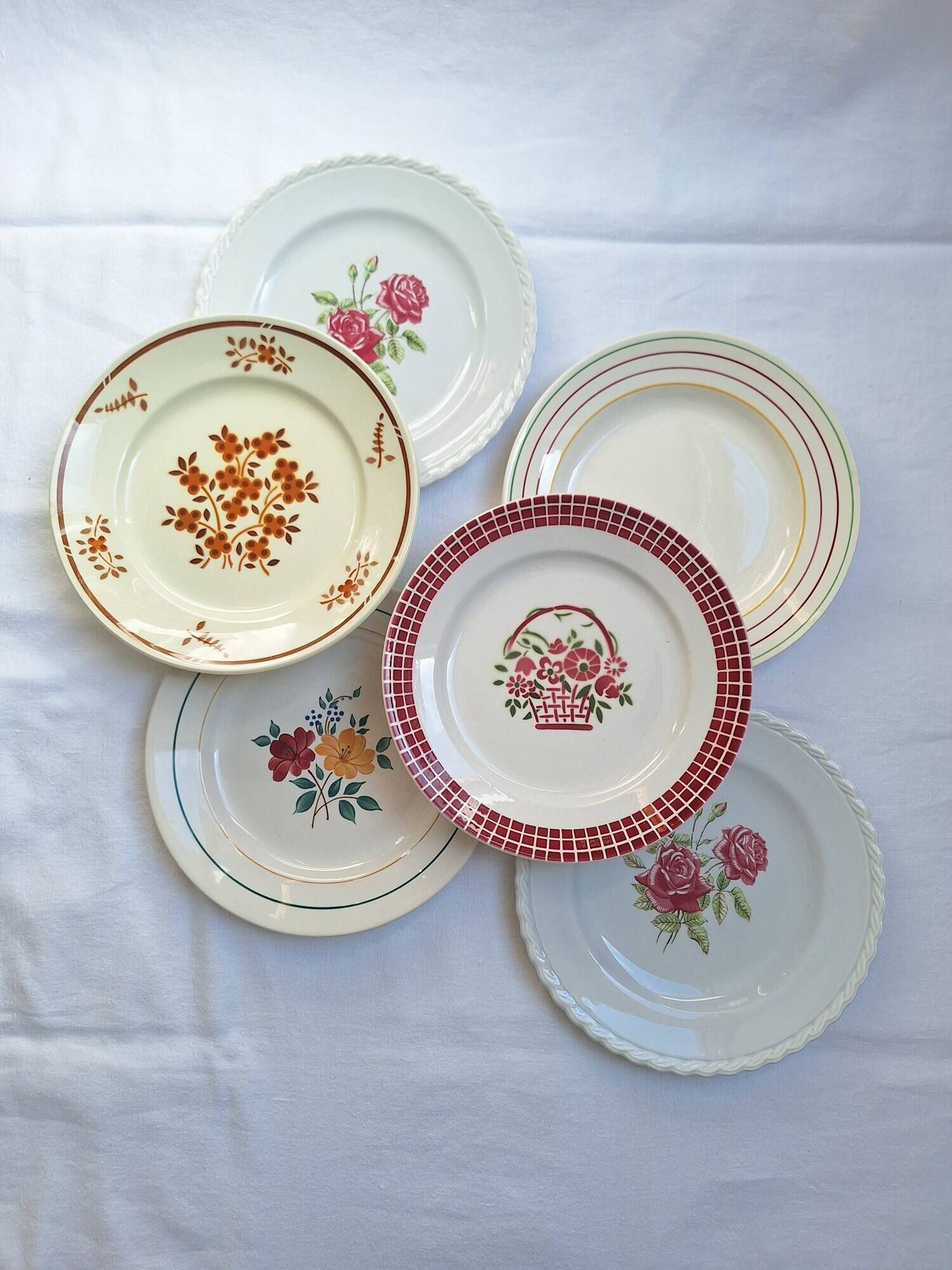 Multicolored flower dinner plates from Moulin des Loups, St Amand and Badonville