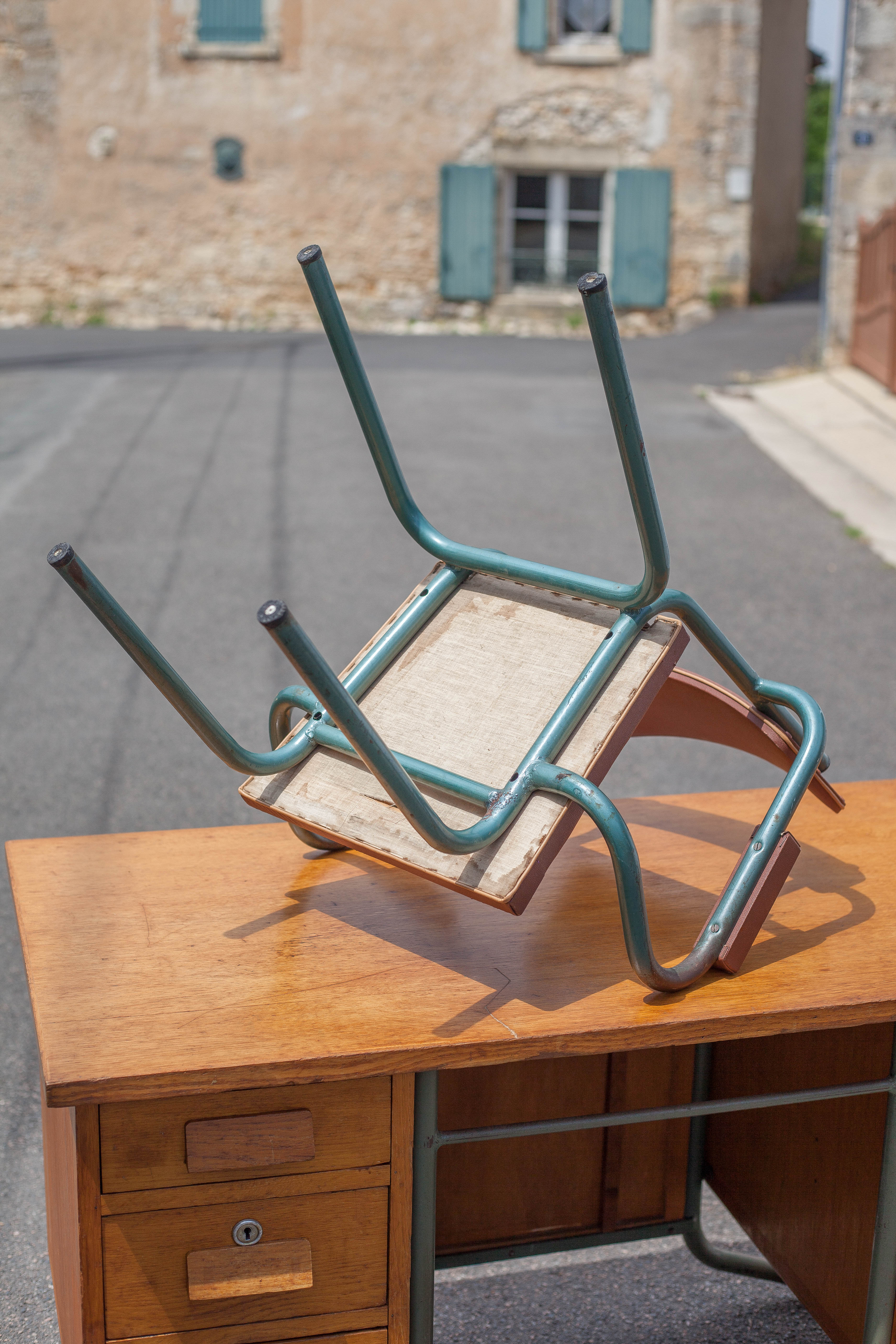 School teacher's chair in imitation leather and tubular metal