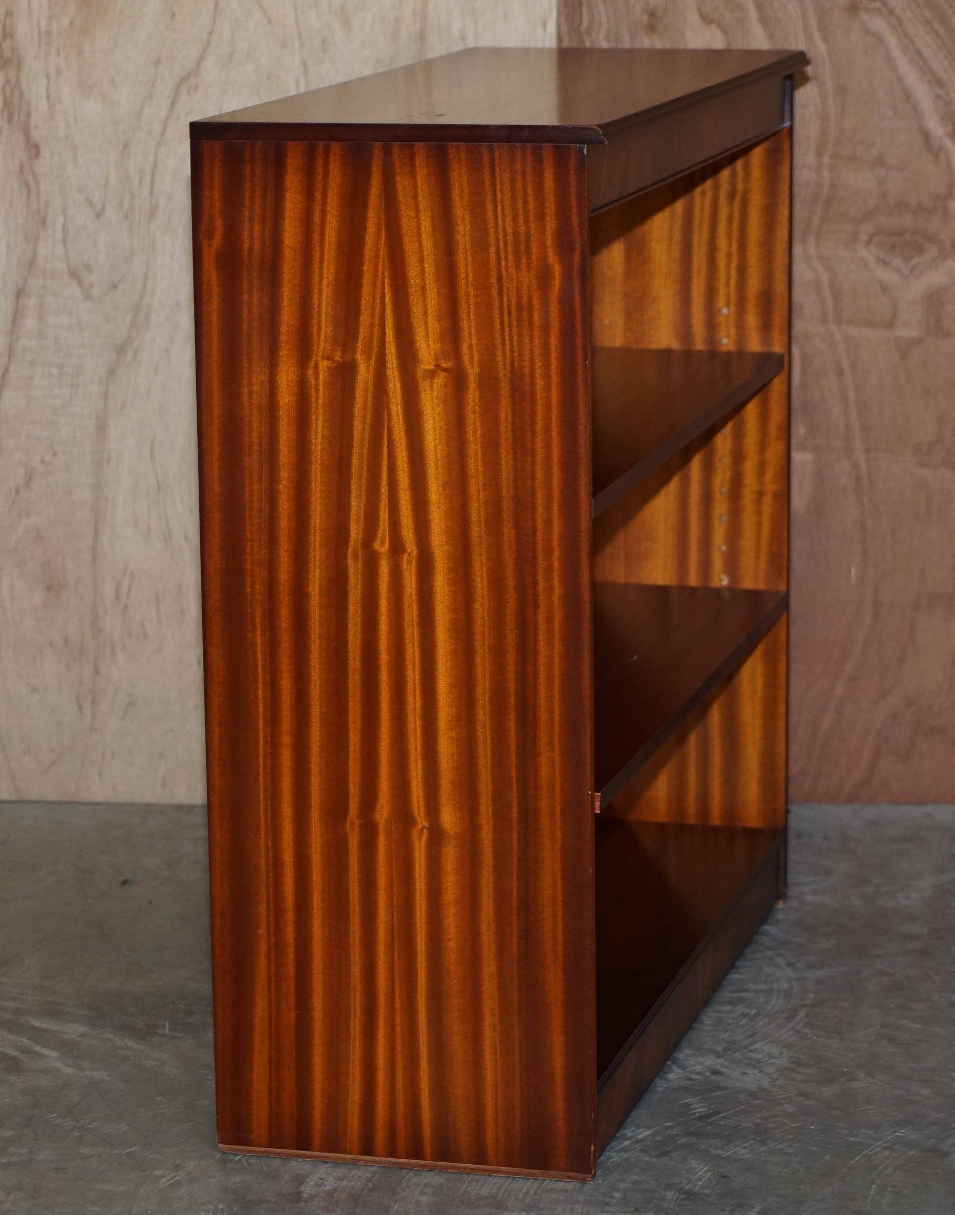 Pair of open low bookshelves Shaws of London in hardwood.