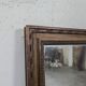 Miroir Napoléon III à cadre en bois sculpté et doré