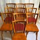 Set of Baumann bistro chairs with a mix of wooden seat and faux leather.