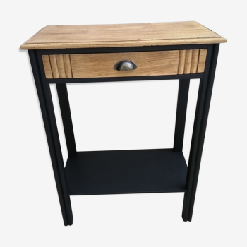 Black art deco console and raw wood