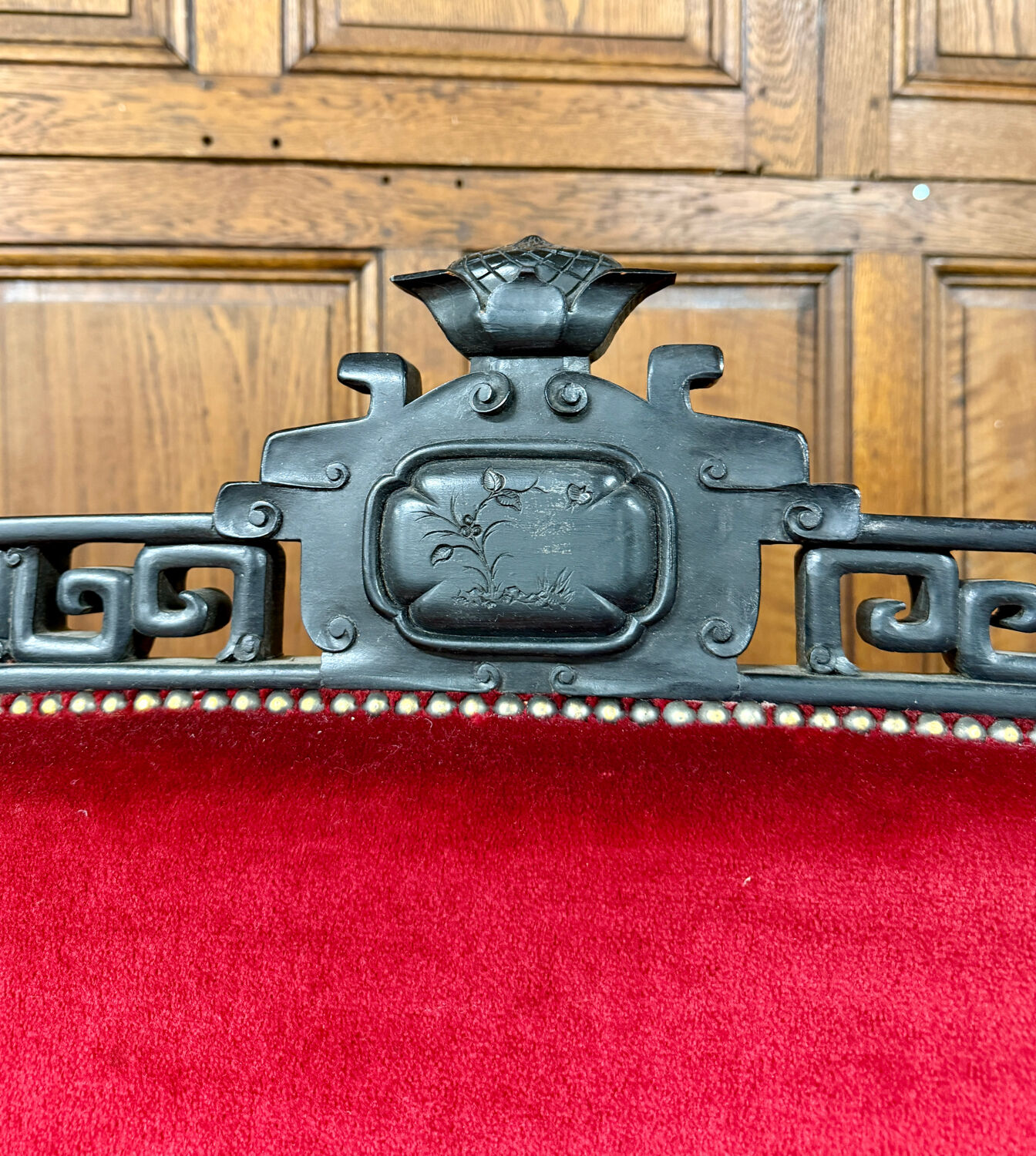 Large Japanese-style sofa in carved wood and red velvet, 19th century