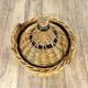Old demijohn in her wicker basket