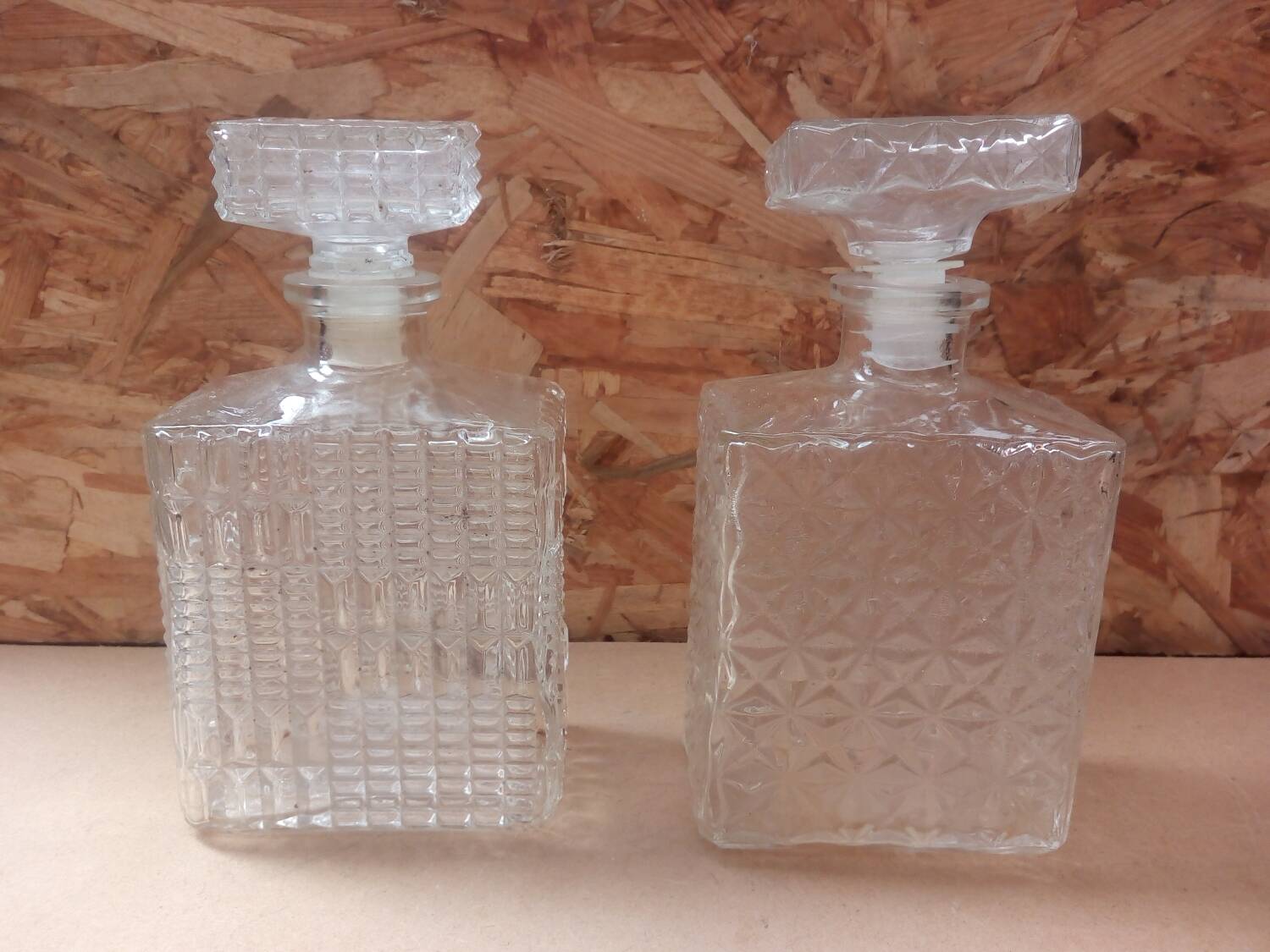 Pair of molded glass whiskey liqueur carafes + vintage stoppers