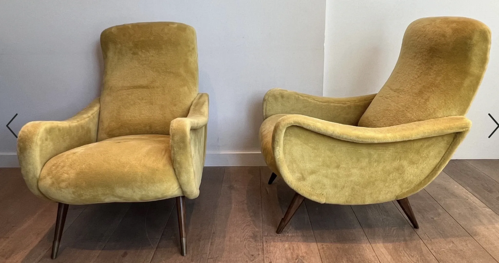 Two designer velvet armchairs from the 1960s in yellow.