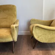 Two designer velvet armchairs from the 1960s in yellow.