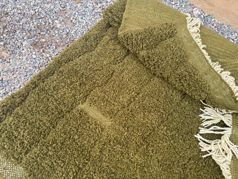 Handmade traditional pure wool rug in green, size 150 x 250 cm.