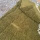 Handmade traditional pure wool rug in green, size 150 x 250 cm.