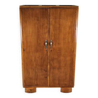 Two-door wardrobe in walnut with brass handles