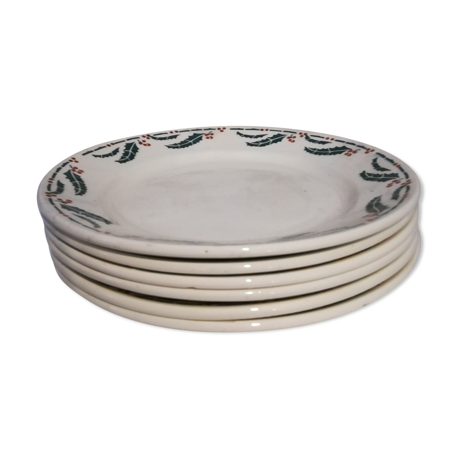 Six flat earthenware plates decorated with holly